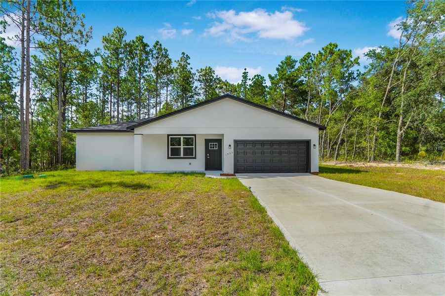 Front exterior of a new home in , Citrus Springs, FL, highlighting curb appeal (Image 1). Front exterior of a new home in , Citrus Springs, FL, highlighting curb appeal (Image 1).