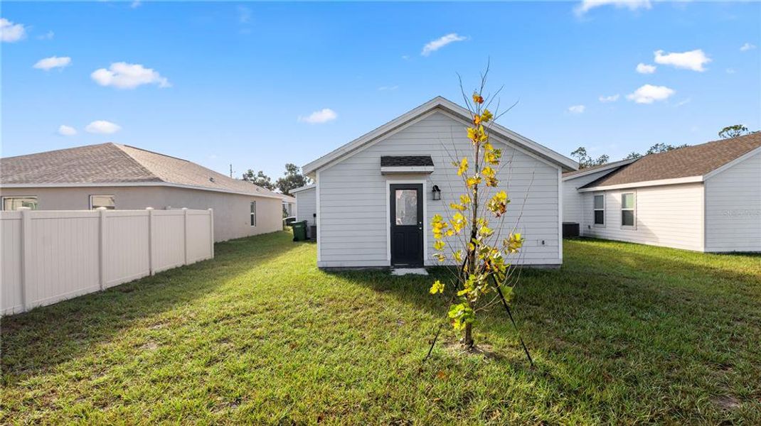 Exterior details and patio area of a home in Peace Creek Reserve: Legacy Collection, Winter Haven (Image 3).