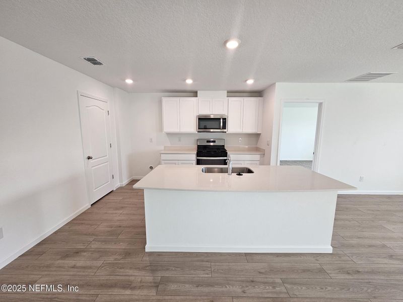 Furnished interior view inside a new home in Entrada, St. Augustine (Image 4).