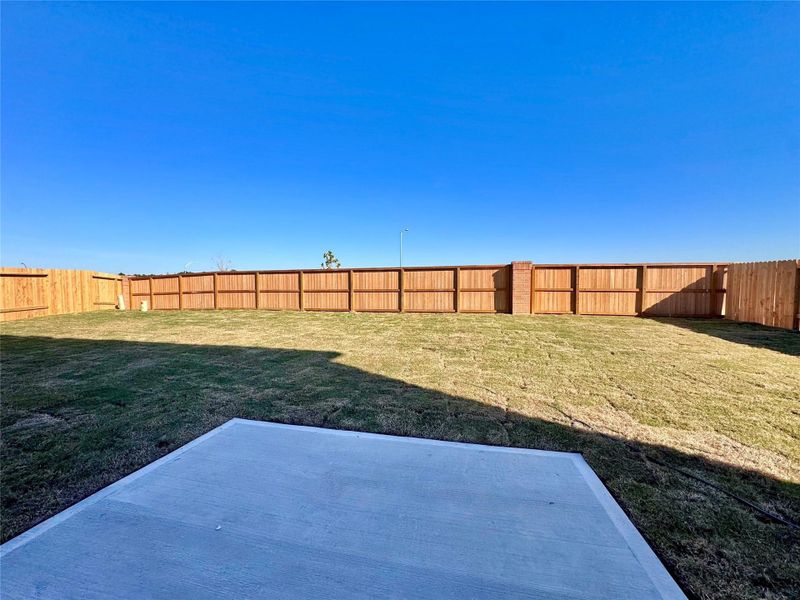 Exterior details and patio area of a home in Spring Creek Trails, Magnolia (Image 14).