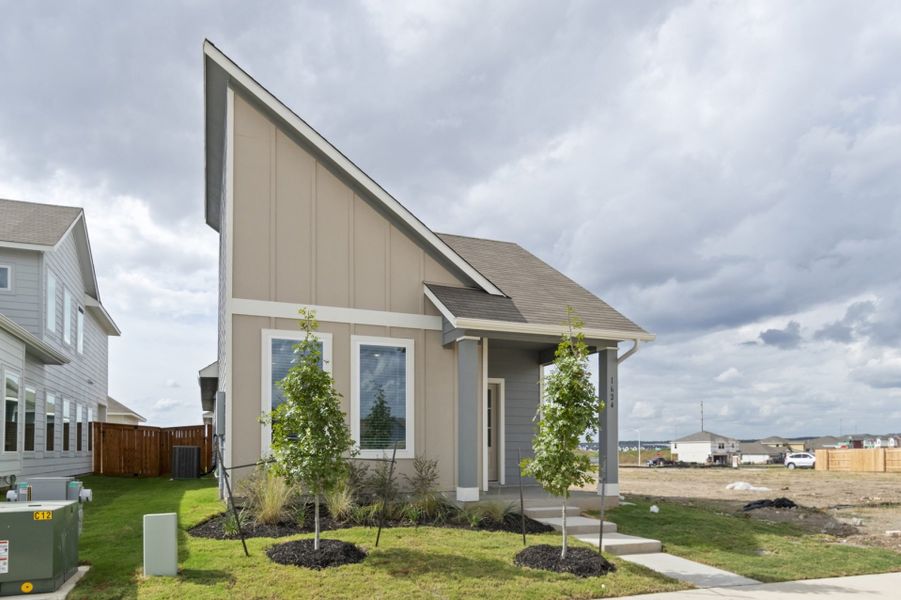Front exterior of a new home in Trace, San Marcos, TX, highlighting curb appeal (Image 21). Front exterior of a new home in Trace, San Marcos, TX, highlighting curb appeal (Image 21).
