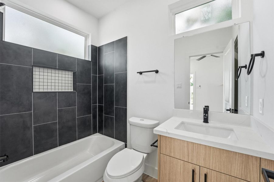 Additional secondary bathroom with updated, elegant finishes.