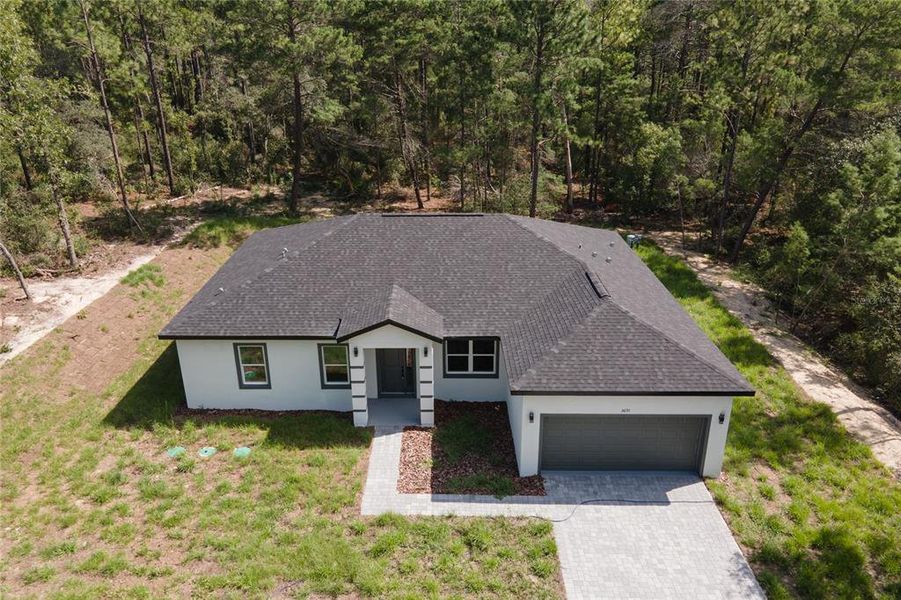 Front exterior of a new home in , Dunnellon, FL, highlighting curb appeal (Image 1). Front exterior of a new home in , Dunnellon, FL, highlighting curb appeal (Image 1).