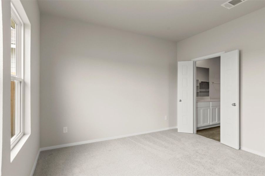 Unfurnished bedroom featuring dark colored carpet