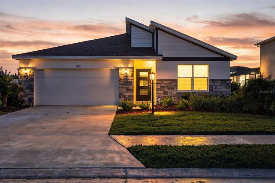 Front exterior of a new home in , Bradenton, FL, highlighting curb appeal (Image 25).