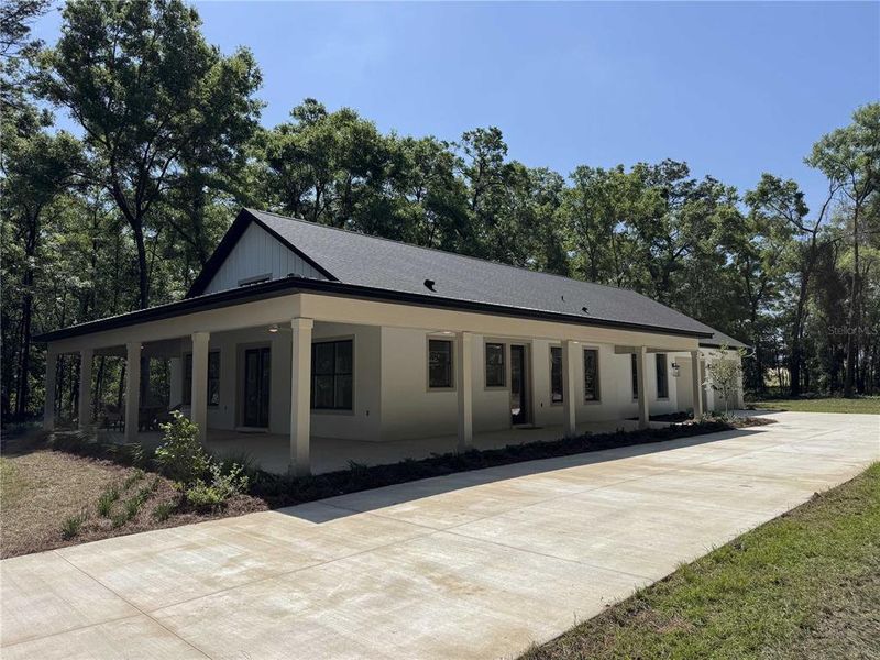 Front exterior of a new home in , Dunnellon, FL, highlighting curb appeal (Image 22).