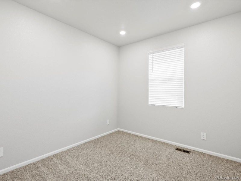 Spacious, unfurnished interior of a new home in Buffalo Highlands: The Flora Collection, Commerce City (Image 17).