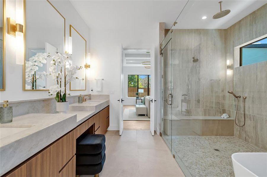 Full bath with a shower stall, double vanity, ensuite bathroom, and recessed lighting Full bath with a shower stall, double vanity, ensuite bathroom, and recessed lighting