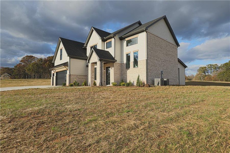 Front exterior of a new home in , Maysville, GA, highlighting curb appeal (Image 25).