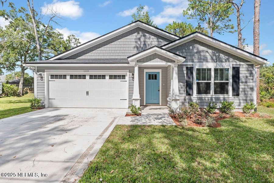 Front exterior of a new home in , Jacksonville, FL, highlighting curb appeal (Image 1). Front exterior of a new home in , Jacksonville, FL, highlighting curb appeal (Image 1).