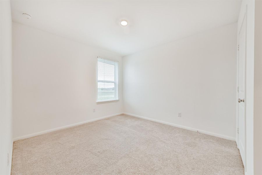 Bedroom #3 located on the second floor is spacious and also offers ample natural lighting.