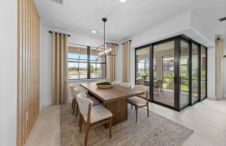 Café area with zero-corner sliding glass door for indoor/outdoor living Café area with zero-corner sliding glass door for indoor/outdoor living