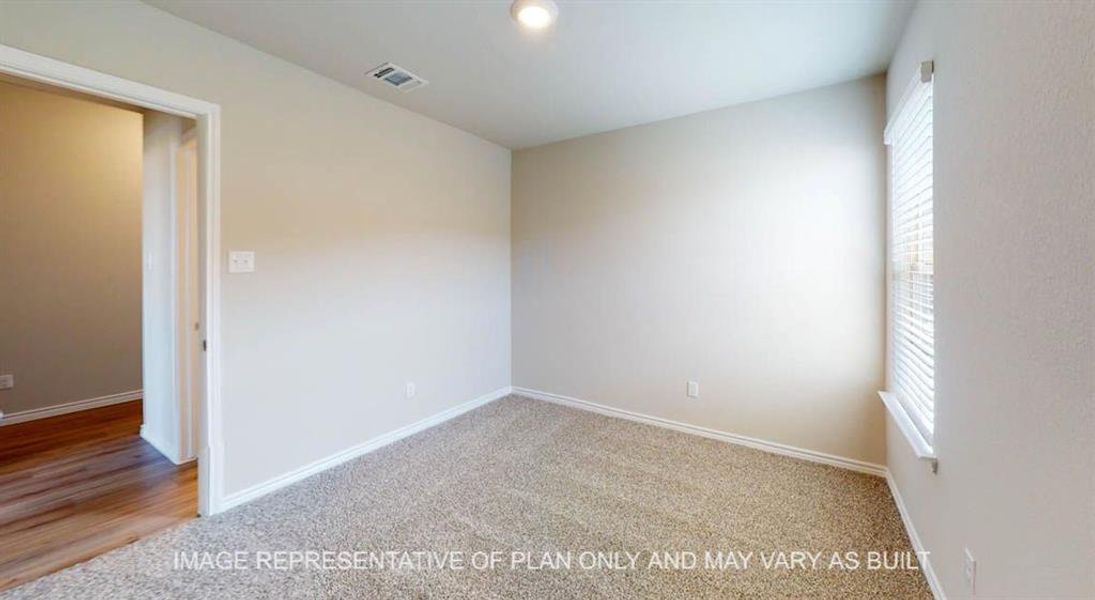 Carpeted spare room with baseboards Carpeted spare room with baseboards