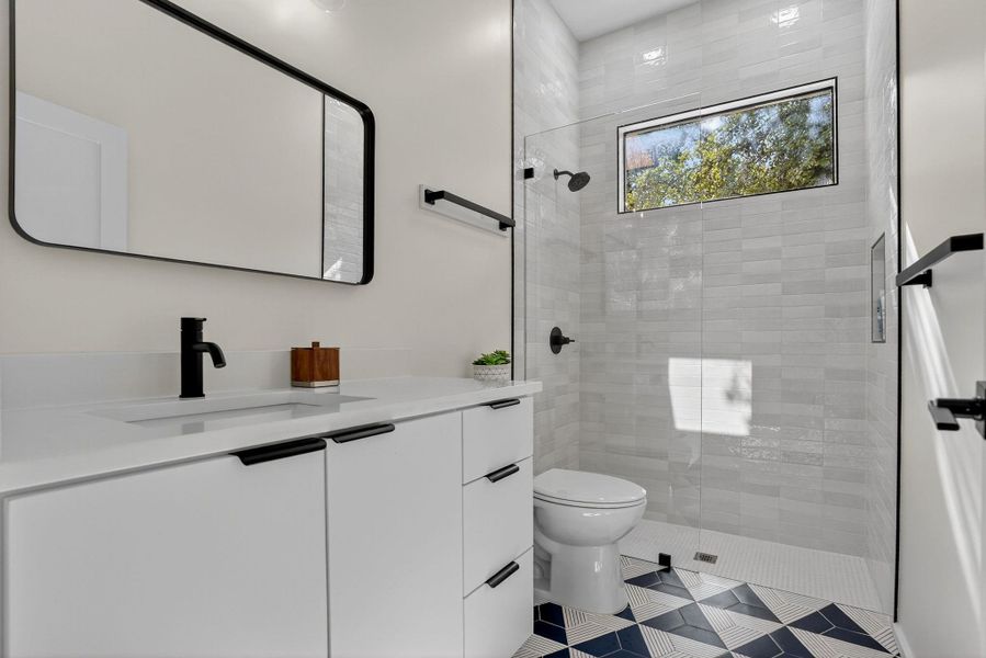 Full bath featuring vanity and walk in shower