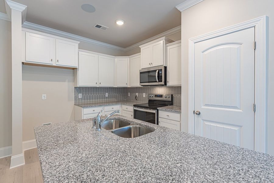 Representative furnished interior of a home built from the Habersham II by Great Southern Homes in Old Charleston Acres, Pelion (Image 6).