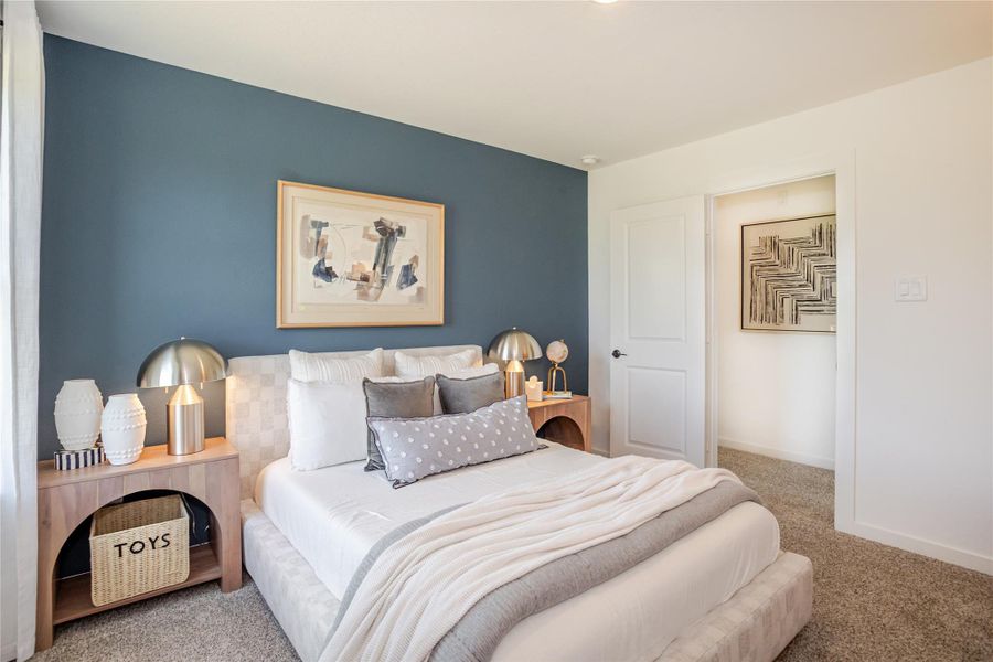 This cozy bedroom features and ample natural light from a large window with serene outside views. This cozy bedroom features and ample natural light from a large window with serene outside views.