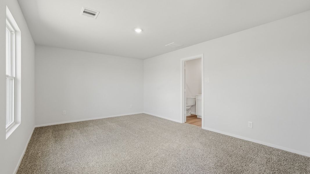 Spacious, unfurnished interior of a new home in Sunterra, Katy (Image 21).