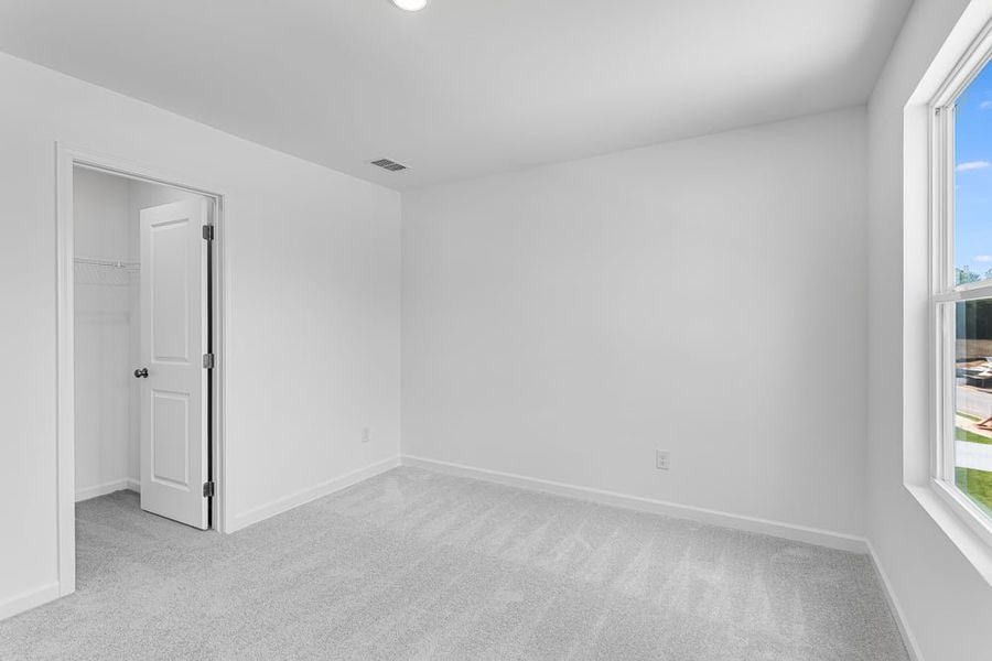 Representative unfurnished interior of a home built from the Avera by Taylor Morrison in Falls Creek, Flowery Branch (Image 29).
