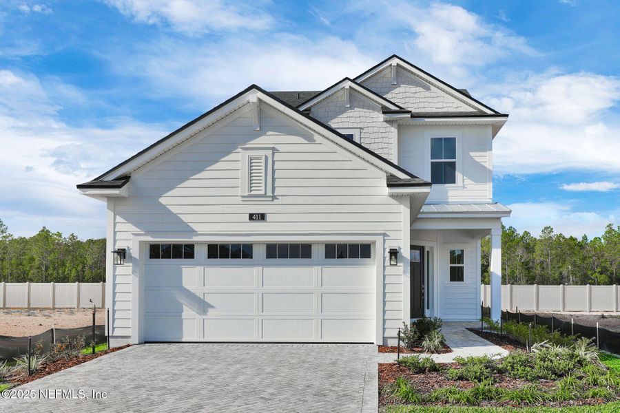 Front exterior of a new home in Seabrook Village at Seabrook, Ponte Vedra, FL, highlighting curb appeal (Image 25).