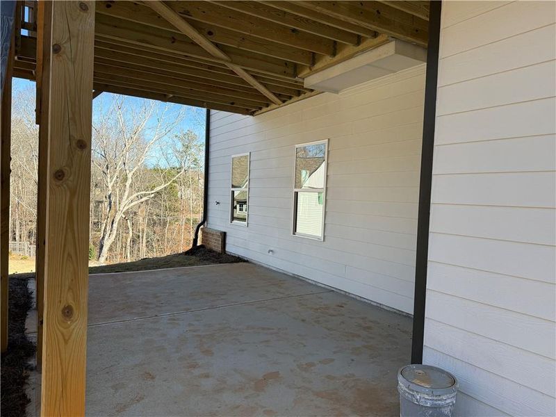 Exterior details and patio area of a home in River Rock, Ball Ground (Image 31).