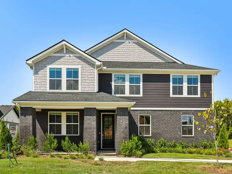 Front exterior of a new home in Station Hill - Estate Series, Franklin, TN, highlighting curb appeal (Image 1). Front exterior of a new home in Station Hill - Estate Series, Franklin, TN, highlighting curb appeal (Image 1).