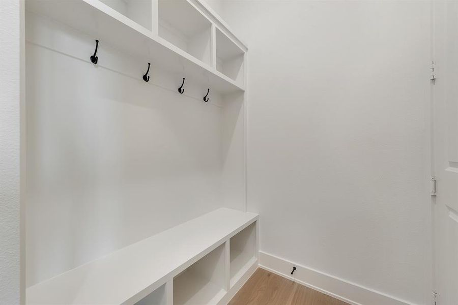 Mudroom with light wood-type flooring Mudroom with light wood-type flooring