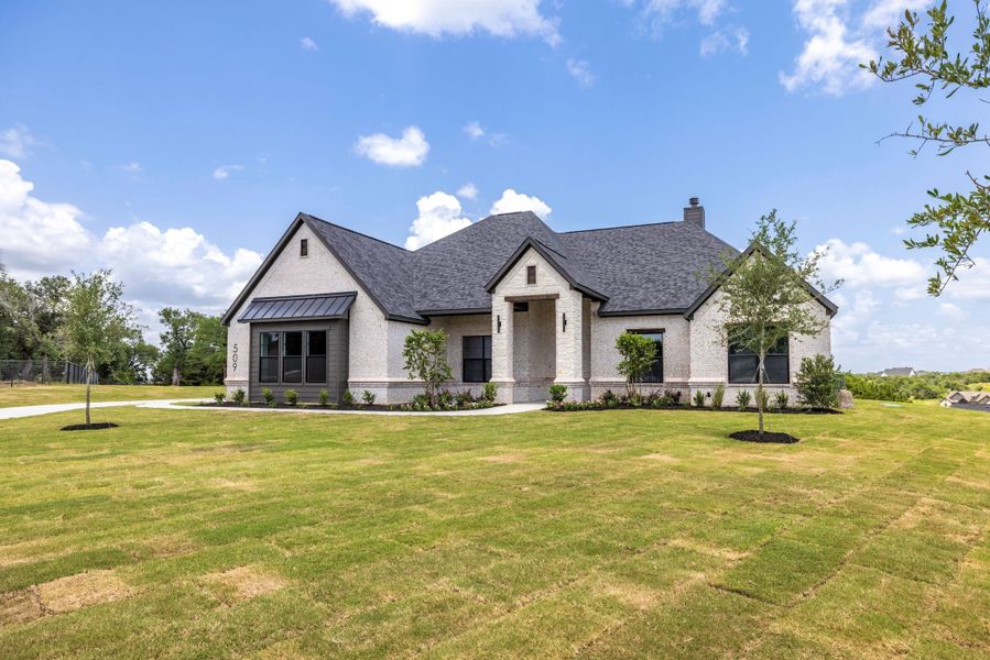 Front exterior of a new home in Vintage Oaks, Weatherford, TX, highlighting curb appeal (Image 21).