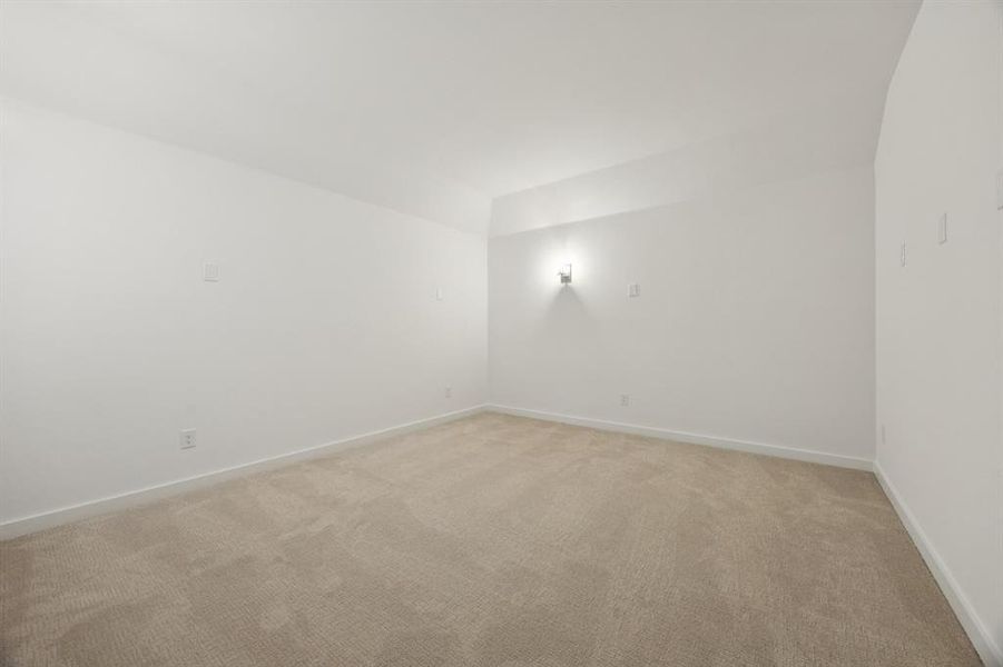 Media Room in the Monet II home plan by Trophy Signature Homes – REPRESENTATIVE PHOTO