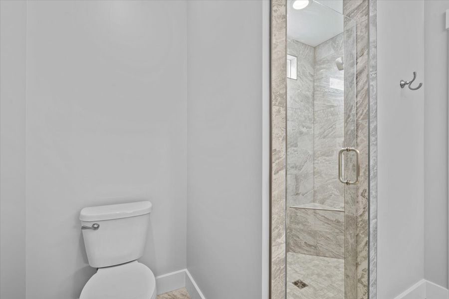 Representative furnished interior of a home built from the Hartford Elite by Enchanted Homes in Pointe Summit, Slater-Marietta (Image 7).