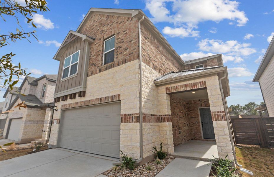 Front exterior of a new home in Horizon Lake, Leander, TX, highlighting curb appeal (Image 21). Front exterior of a new home in Horizon Lake, Leander, TX, highlighting curb appeal (Image 21).