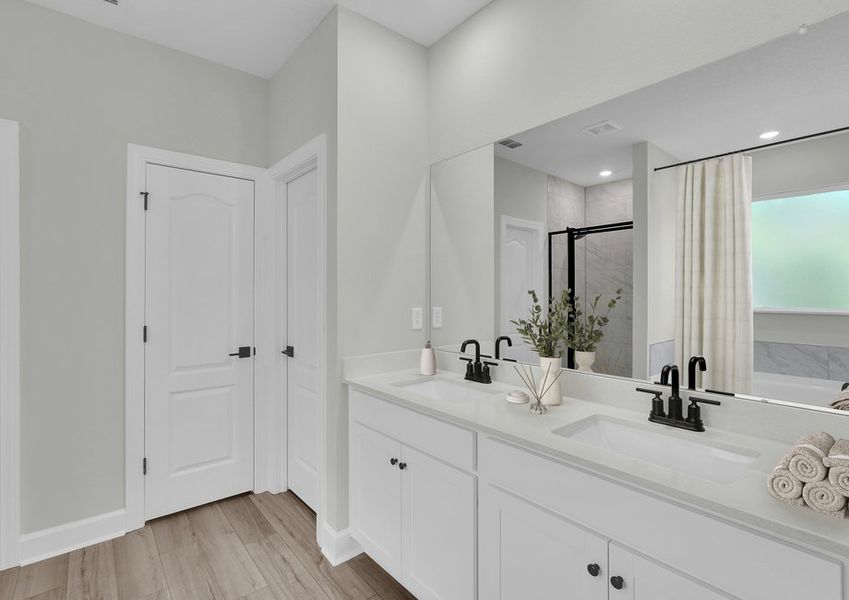 This spacious master bathroom provides you all the space you need to get ready in the morning