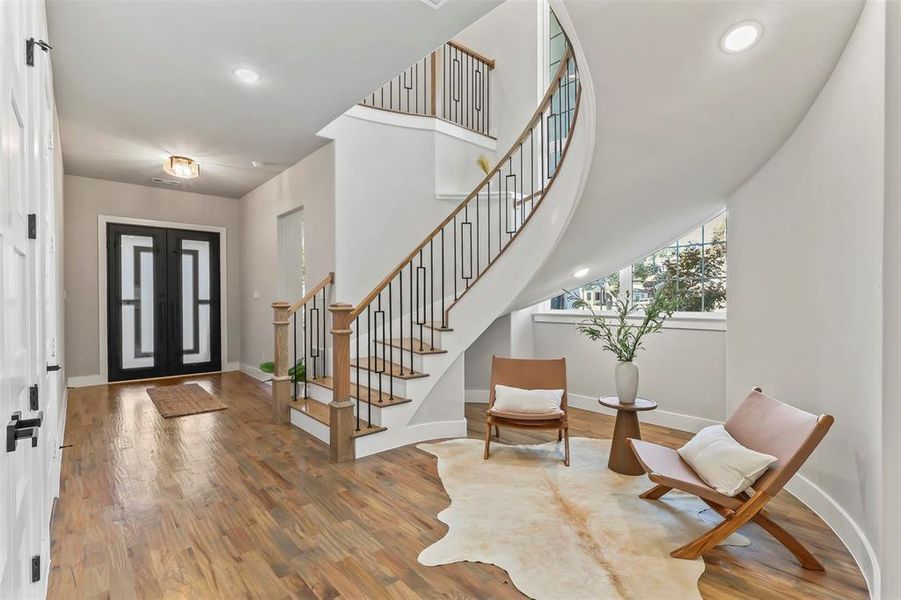 Entryway with wood finished floors and recessed lighting Entryway with wood finished floors and recessed lighting