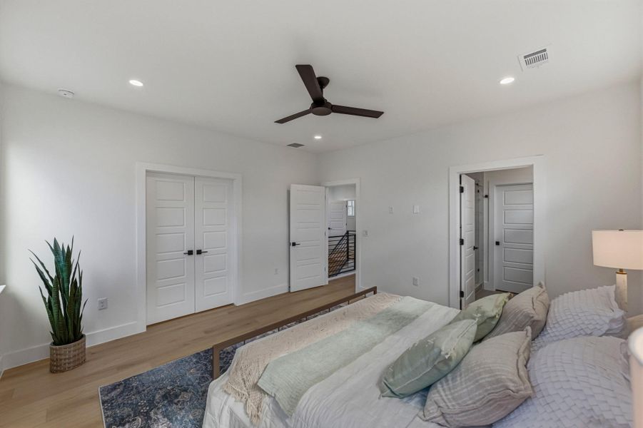 Bedroom featuring wood finished floors, ceiling fan, a closet, and recessed lighting