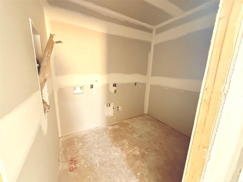 Utility room off of living room and primary