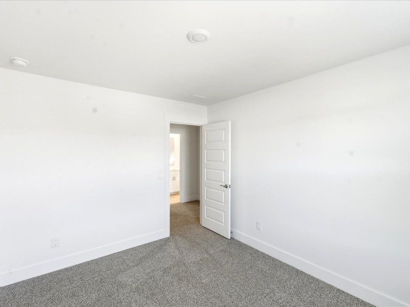 Spacious, unfurnished interior of a new home in The Coves at Lakes of Cane Bay II, Summerville (Image 22).