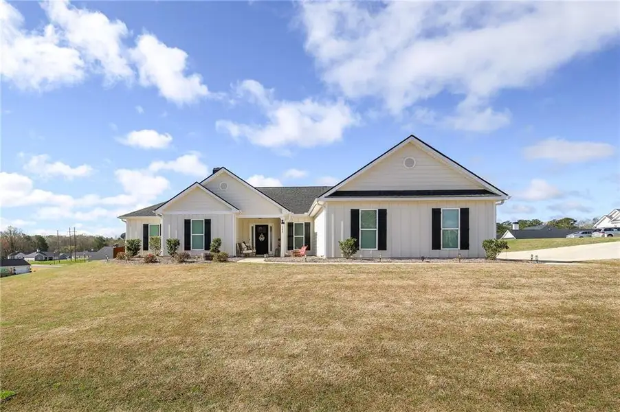 Front exterior of a new home in , Winder, GA, highlighting curb appeal (Image 1). Front exterior of a new home in , Winder, GA, highlighting curb appeal (Image 1).