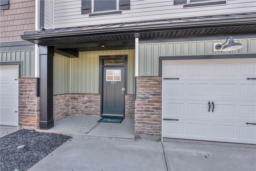 The welcoming entryway offers both comfort and pri