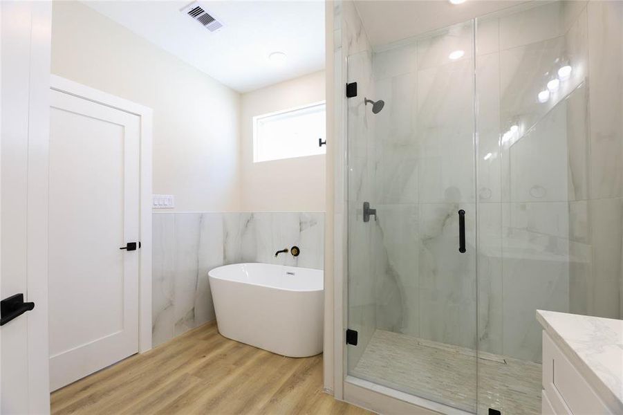 Soaking tub & separate walk-in shower.