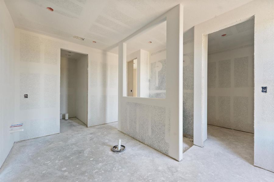 Luxurious primary en-suite featuring an elegant tub and a walk-through shower with dual rain shower heads. Includes double vanities, a separate water closet, and two spacious closets. Luxurious primary en-suite featuring an elegant tub and a walk-through shower with dual rain shower heads. Includes double vanities, a separate water closet, and two spacious closets.