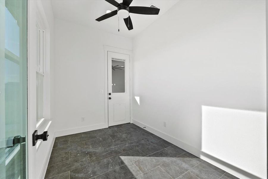 Unfurnished room featuring ceiling fan