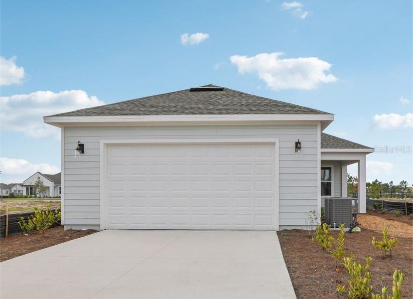 Front exterior of a new home in Weslyn Park Single Family, St. Cloud, FL, highlighting curb appeal (Image 23).