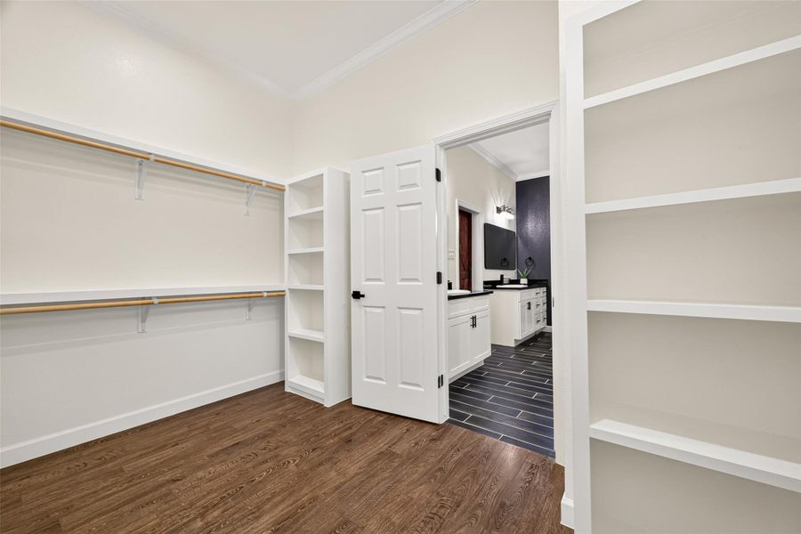 Oversized walk-in closet offers plenty of room for storage and organization.