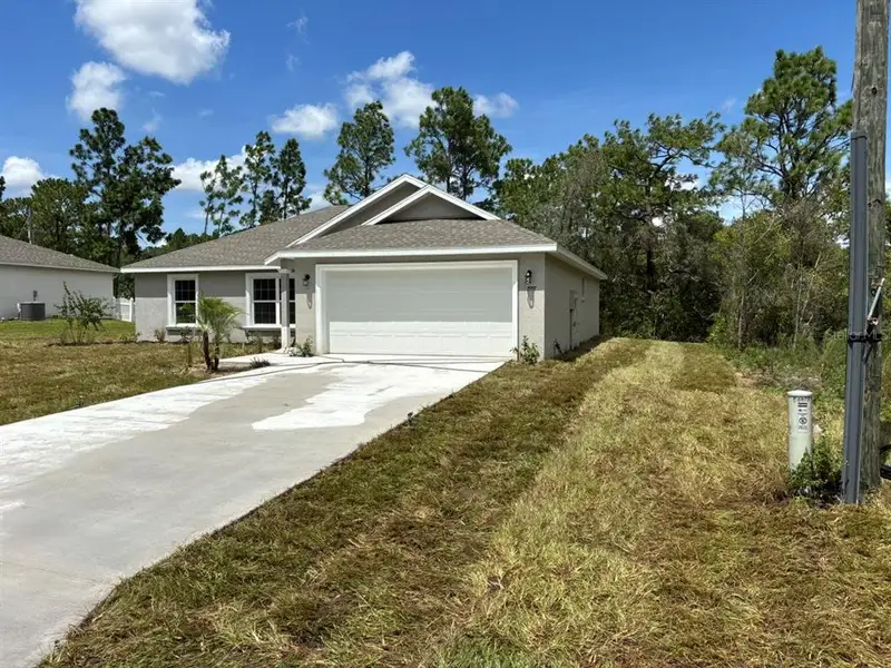 Front exterior of a new home in , Dunnellon, FL, highlighting curb appeal (Image 16). Front exterior of a new home in , Dunnellon, FL, highlighting curb appeal (Image 16).
