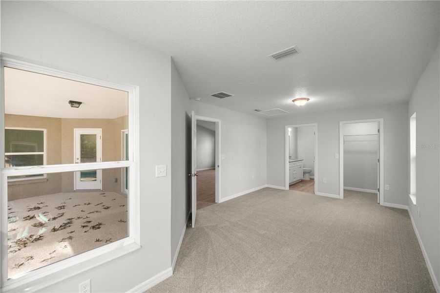 Primary Bedroom overlooking enclosed lanai