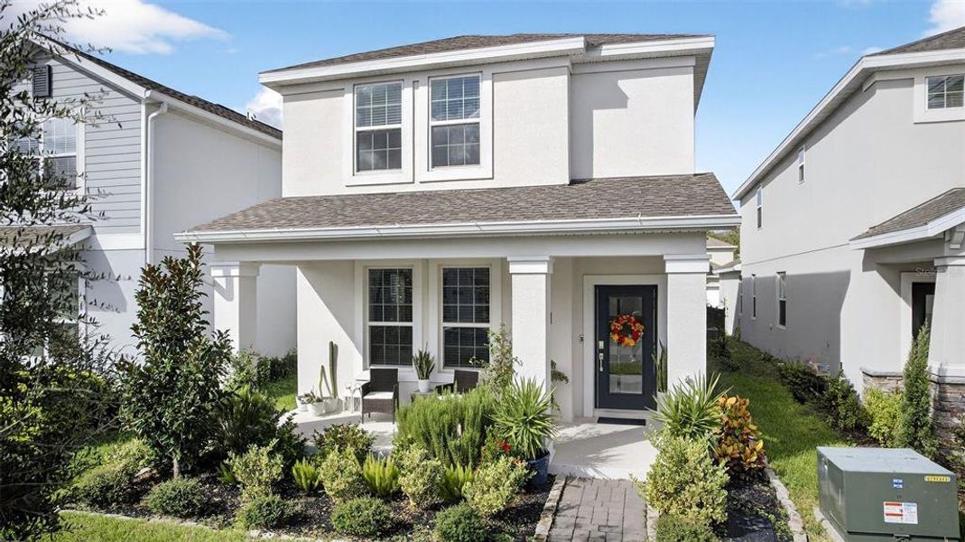 Exterior details and patio area of a home in Storey Park: Innovation Cottage Collection, Orlando (Image 1).
