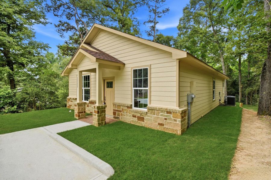 Exterior details and patio area of a home in , Coldspring (Image 3). Exterior details and patio area of a home in , Coldspring (Image 3).