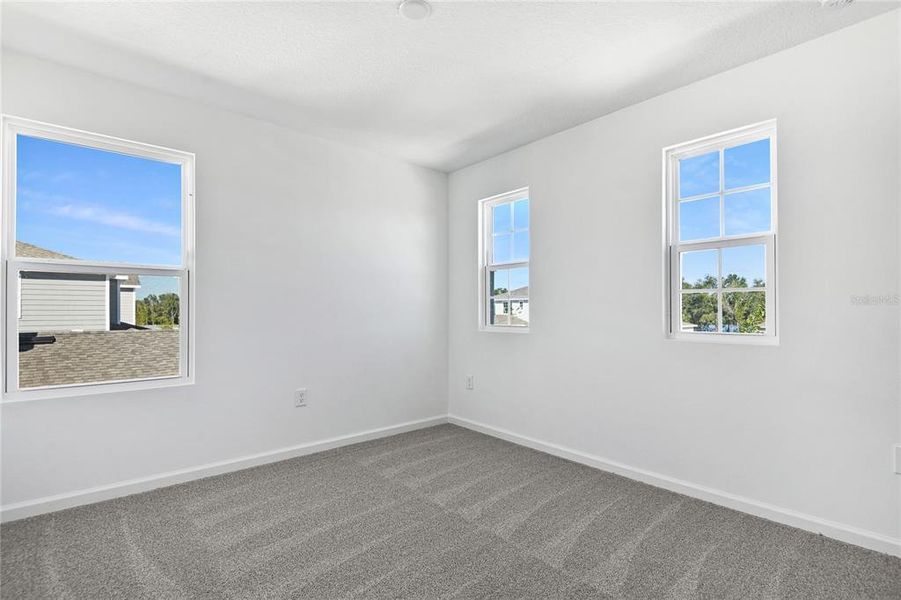 Spacious, unfurnished interior of a new home in Seasons at Shores of Lake Dell, Dundee (Image 11).