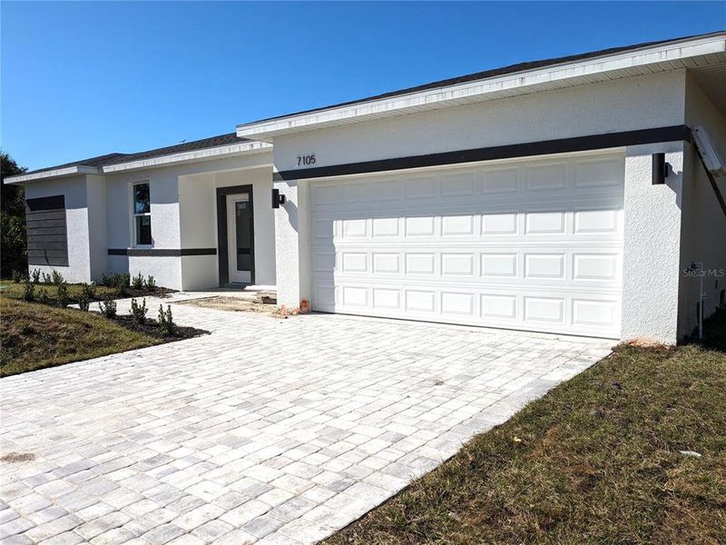 Front exterior of a new home in , Port Charlotte, FL, highlighting curb appeal (Image 15). Front exterior of a new home in , Port Charlotte, FL, highlighting curb appeal (Image 15).