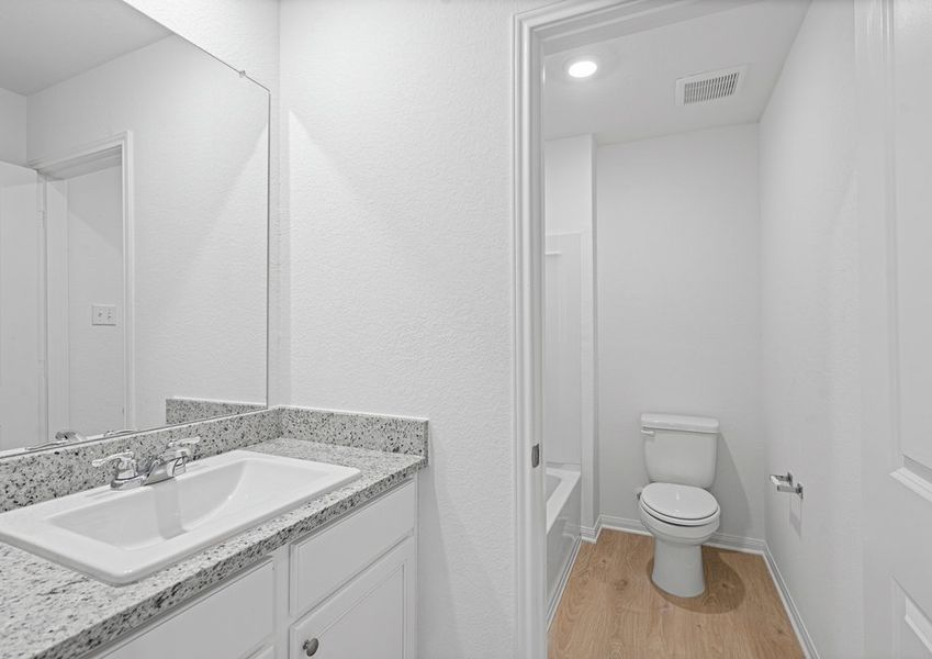 Secondary bathroom with granite countertops