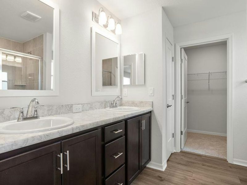 Your suite is complete with a walk-in wardrobe and a large en-suite bath with a tiled shower.